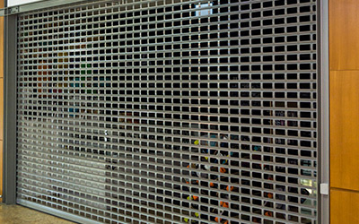 Retail & Shopfronts Perforated roller shutters commercial shop front London & Kent