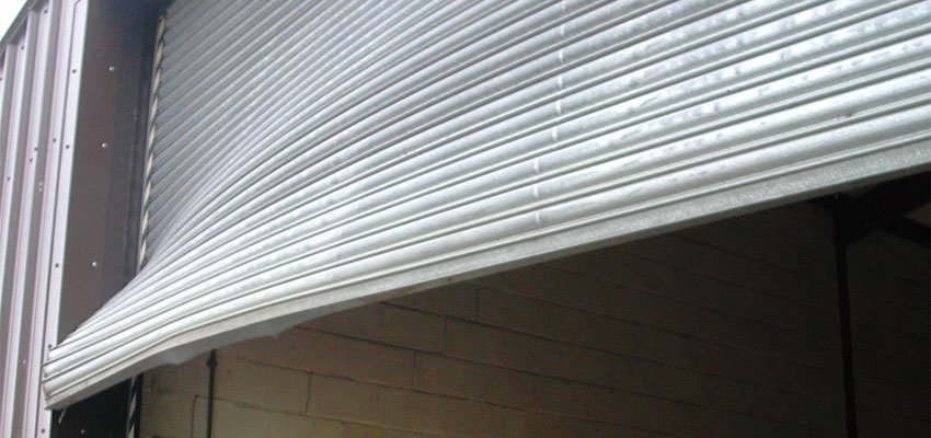 A damaged commercial roller shutter.
